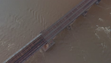 drone footage of train bridge and tracks in lancaster, pennsylvania - cold color grade
