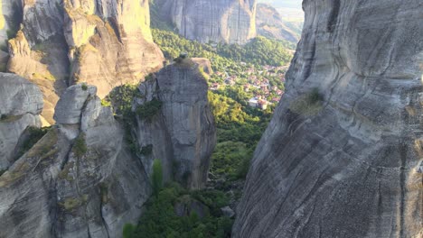 Low-altitude-flying-between-giant-rocks-in-Meteora,-Greece,-aerial