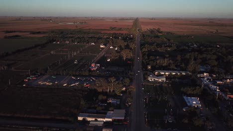 aerial drone shot from ruta 9 cordoba argentina with a truck parking down in the leftside in the sunset rural area