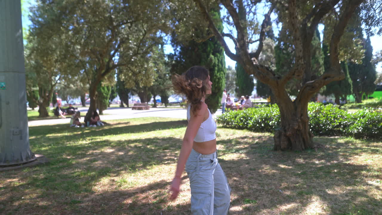 Woman Dancing in a Park