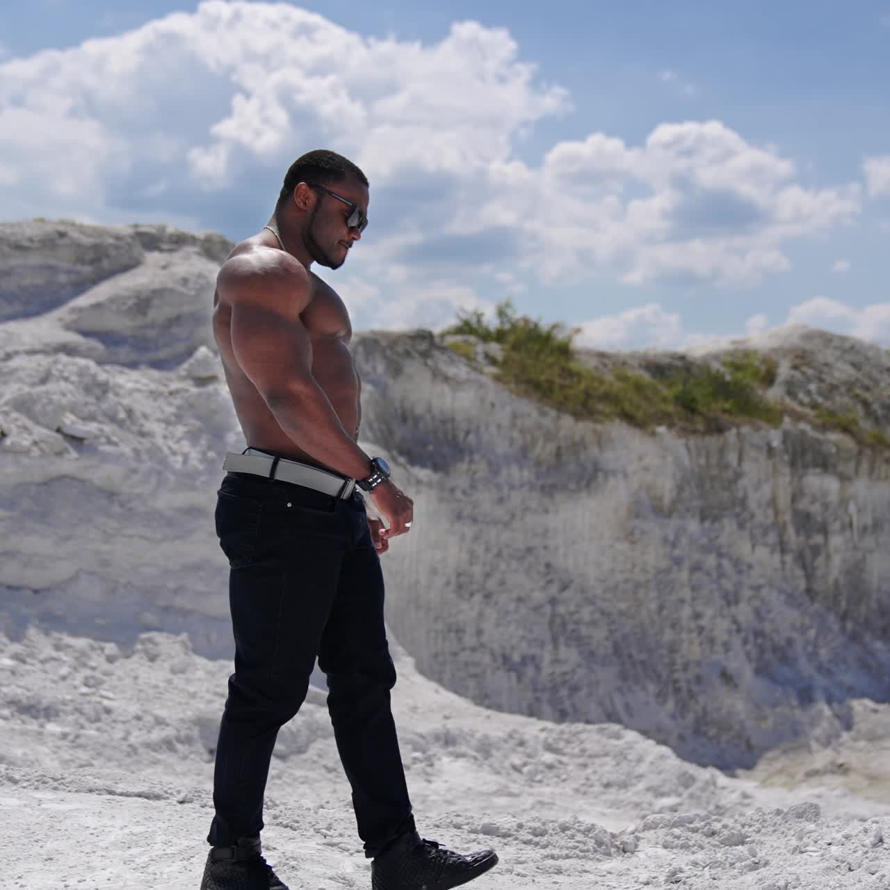 Beauty and perfection of human body. Muscular black african man body topless outdoor