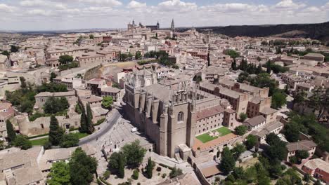 aerial arc shot of monastery of san juan de los reyes, toledo, spain