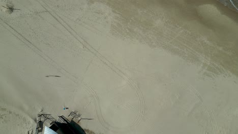 4K-Isolated-top-aerial-view-of-a-vacant-beach-with-a-few-people---Bat-Yam-Israel