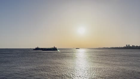 Ships-passing-by-the-sea-at-sunset-on-the-beach