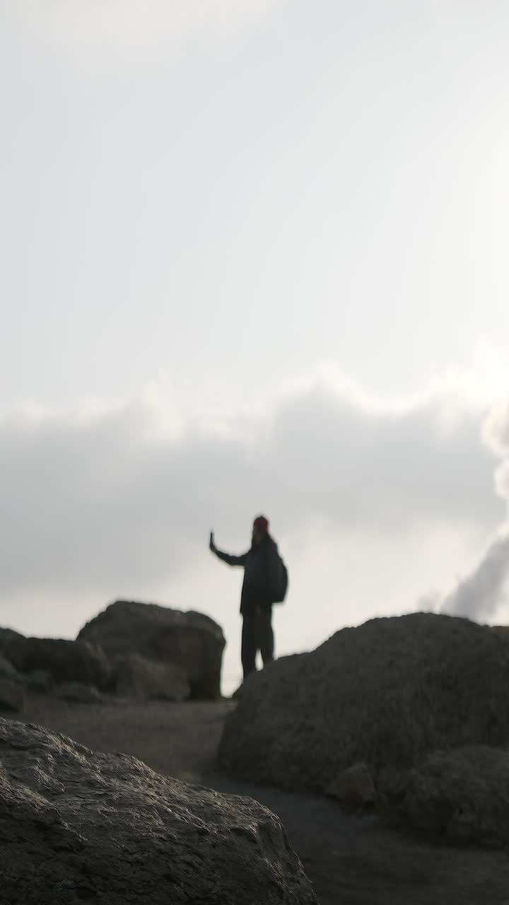 Hiker on Rocky Terrain