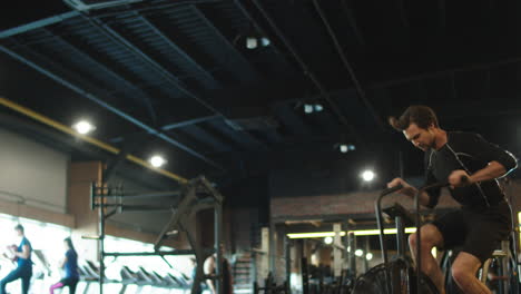 sport man using velosimulator at gym