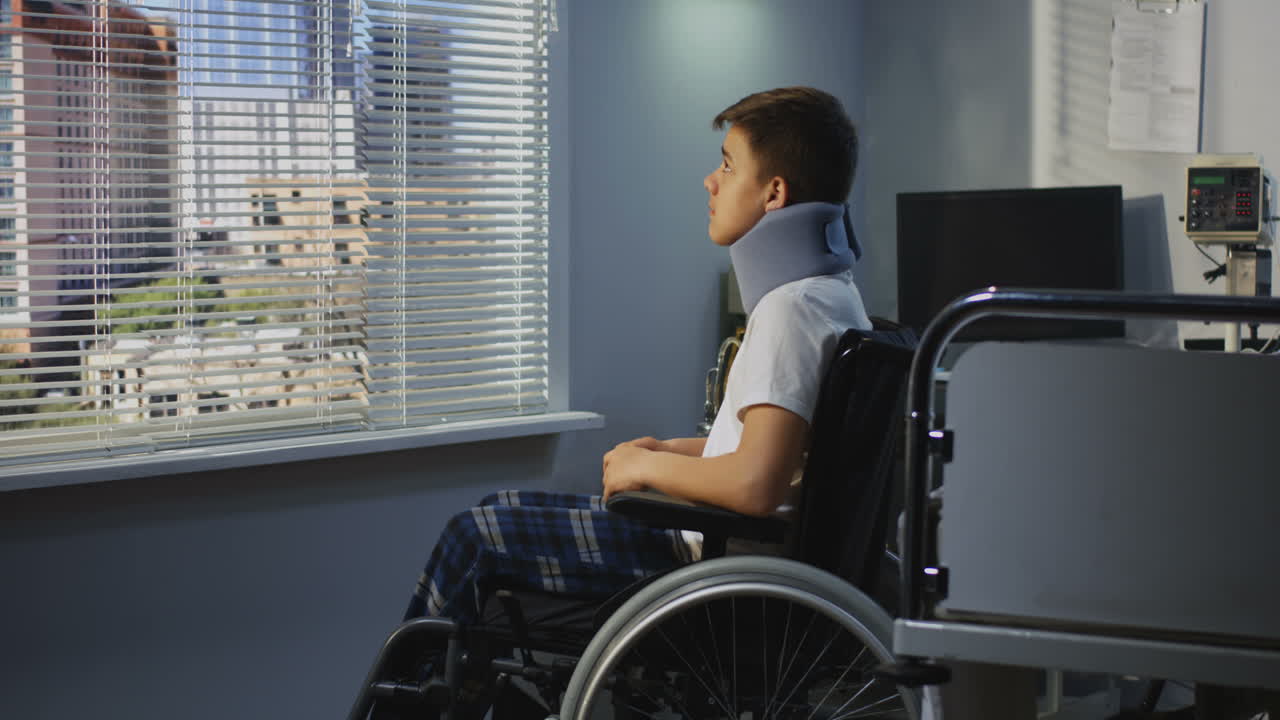 Injured Teenager in Hospital Wheelchair