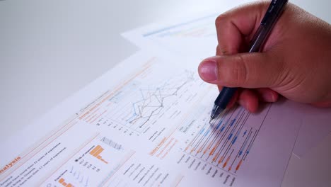 man hands with pen-filling on papers