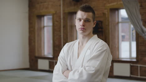 young man with white uniform indoors