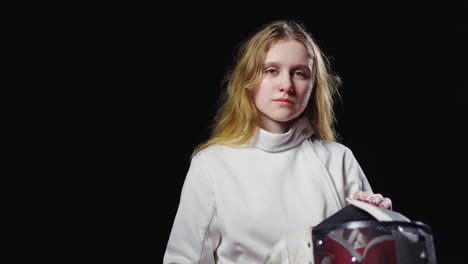 young woman fencer in uniform