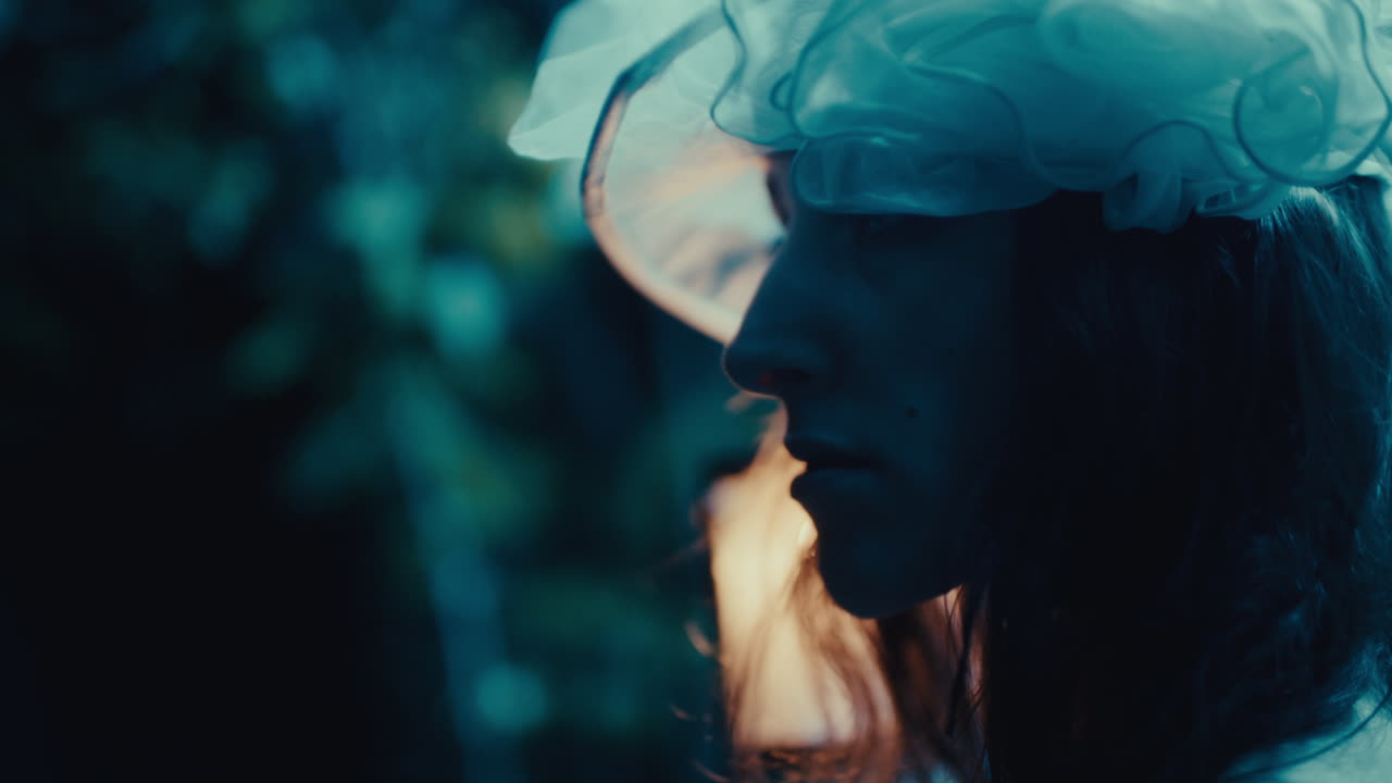 A Woman Holding a Lantern in the Dark