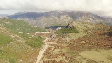 Aerial-establishing-shot-of-a-road-in-a-mountain-valley-of-Argentinian-Patagonia