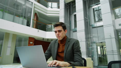 businessman working on laptop in office center