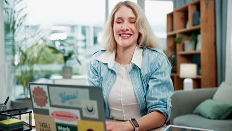 woman smiling in front of laptop
