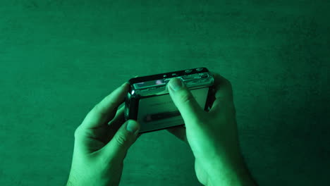 hands holding a retro usb cassette player