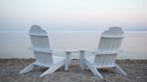 Empty-wooden-deck-chairs-on-a-beach