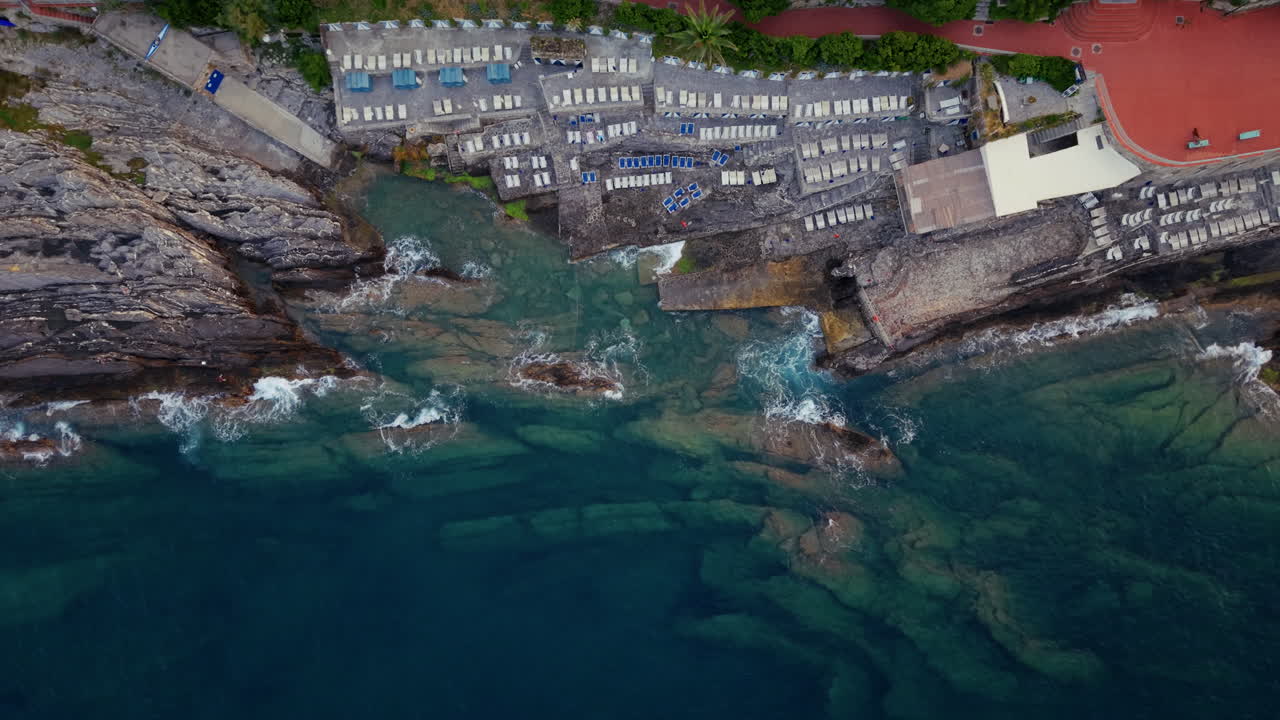 Calm Aerial View of Colorful Genoa, Italy, with Houses and Small Port