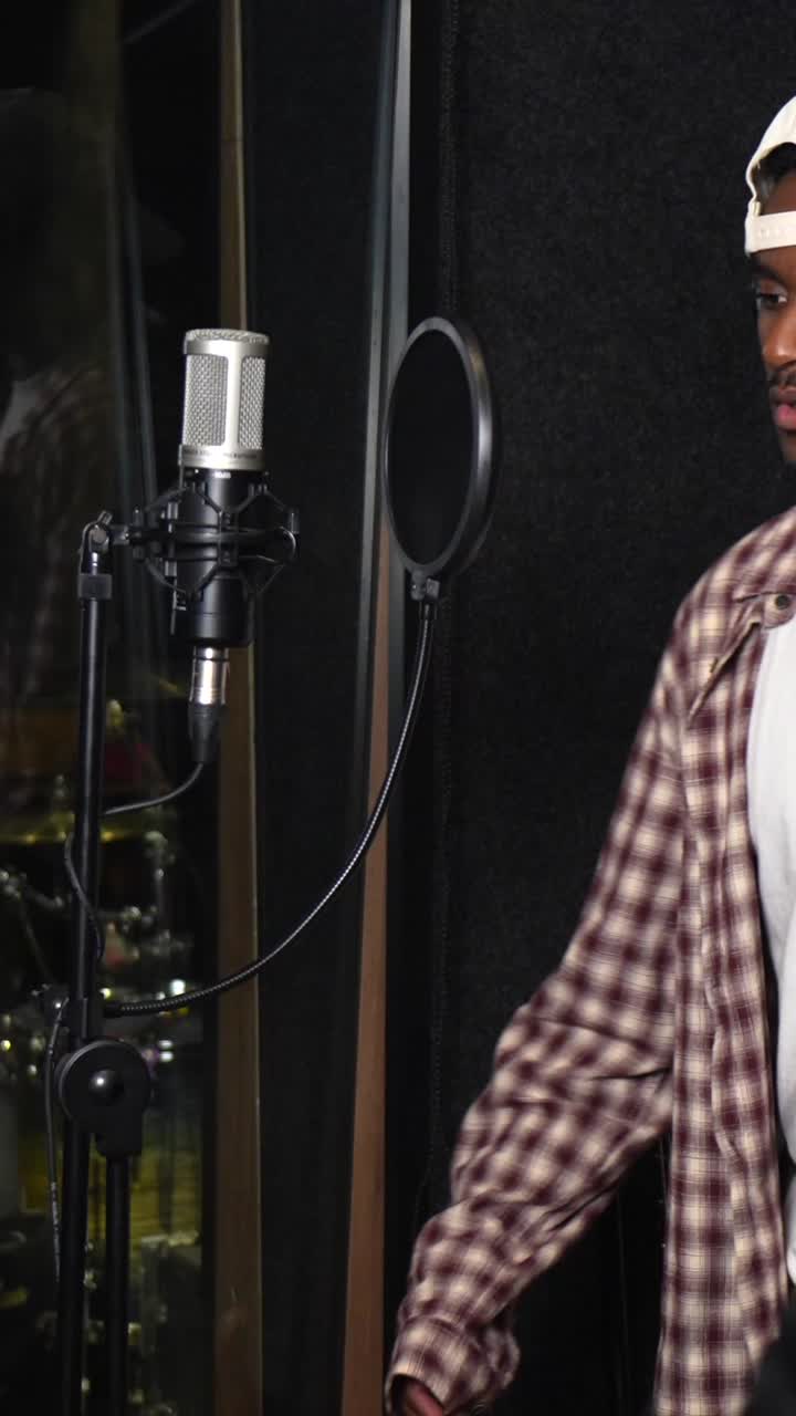 People Recording Music in a Studio