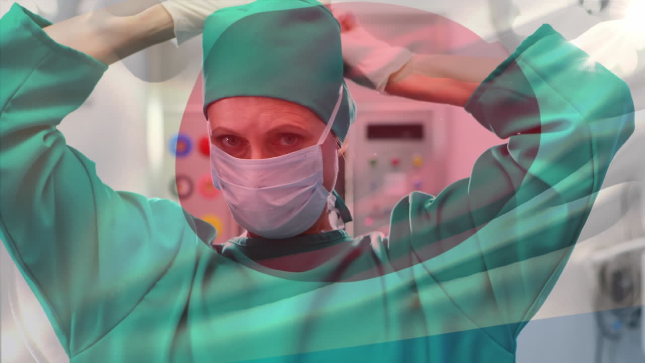 수술실 에서 외과 의사 들 위 에 흔들리는 일본 국기 의 애니메이션