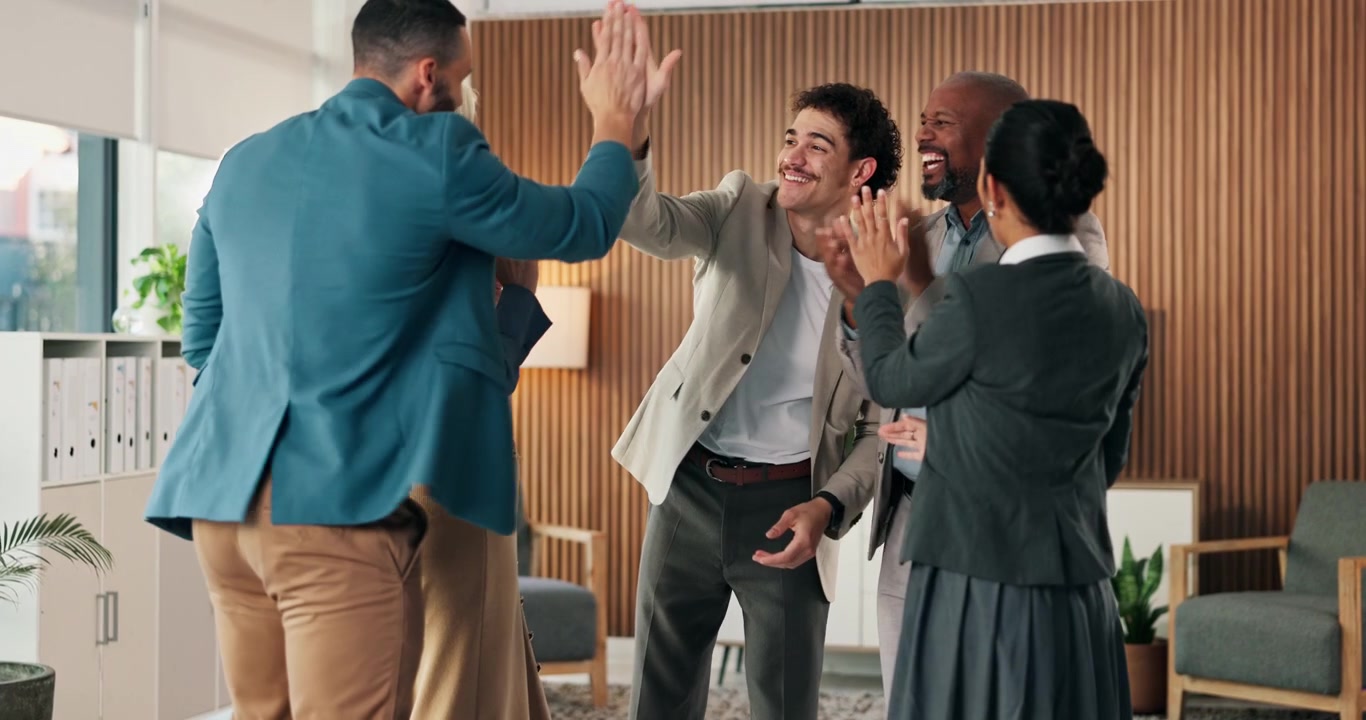 Diverse Business Team Celebrating Success with High Fives and Applause