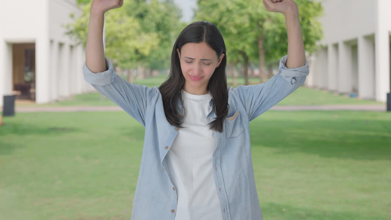Tired and lazy Indian girl yawning