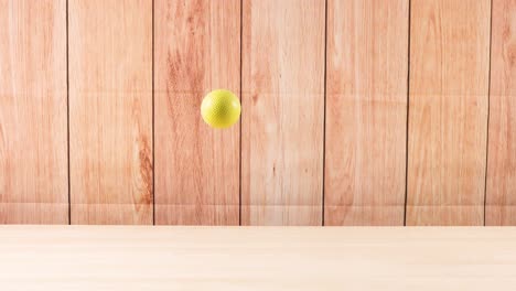 una pelota rebota en una superficie de madera