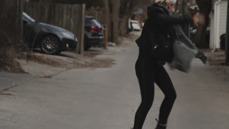 a young person dances freely in the streets