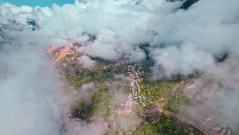 high-altitude drone descent reveals cosñirhua-malata annex in spring amid intense post-rain clouds