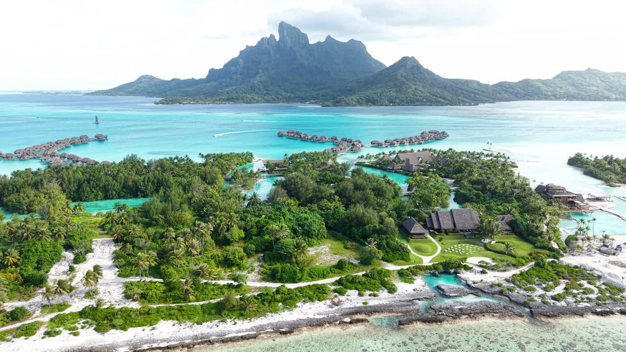 Bora Bora, French Polynesia. Drone Shot of Luxury Tropical Resort on Island, Bungalows and Lagoon