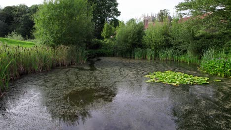 Aerial-video-footage-of-the-remains-of-Bolingbroke-Castle-a-13th-century-hexagonal-castle,-birthplace-of-the-future-King-Henry-IV,-with-adjacent-earthwork