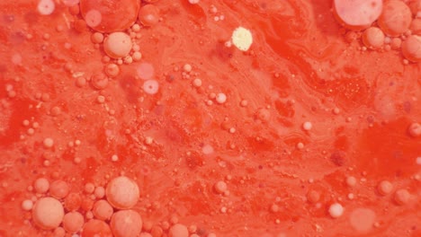 red abstract fluid art with bubbles