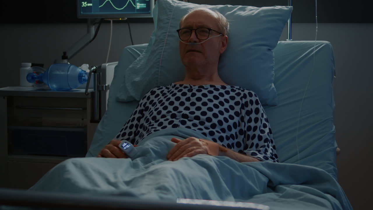 Sick elderly man with health problems staying in hospital