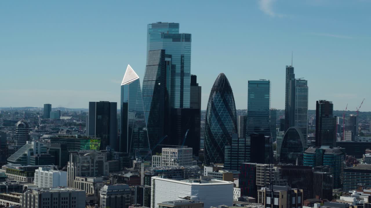 Aerial establishing shot of the City of London featuring famous skyscrapers and offices