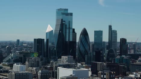 aerial establishing shot of the city of london featuring famous skyscrapers and offices