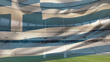 flag blowing in front of a stadium