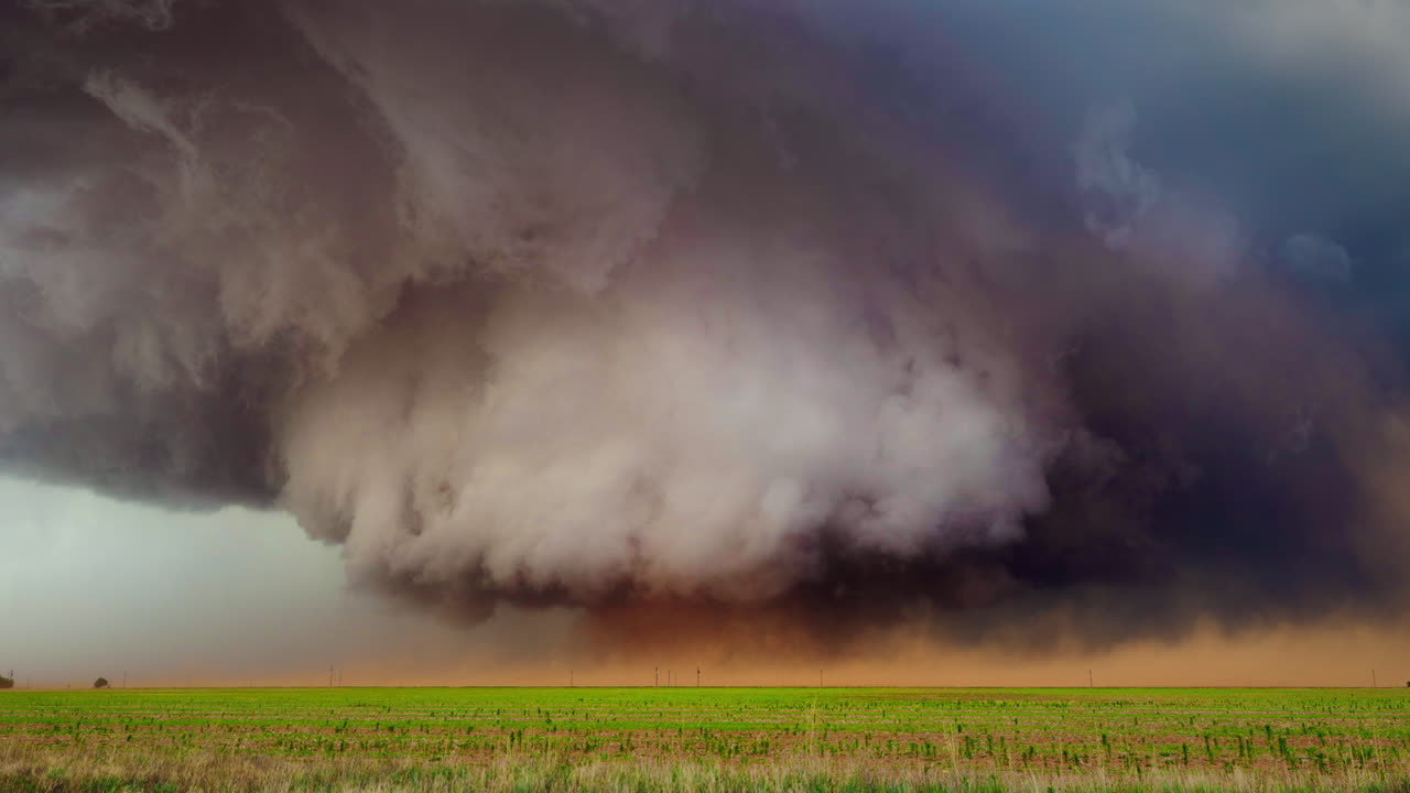 Rotating Supercell Producing a Large Dusty Tornado