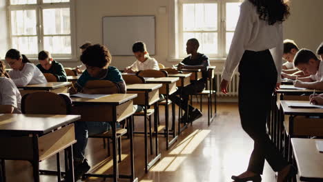 classroom scene: students taking an exam