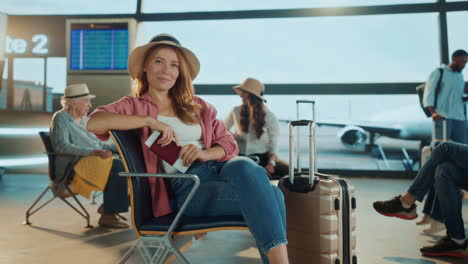 woman waiting at airport departure lounge