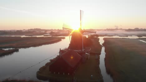 view-from-drone-windmill-with-sunrise-with-low-clouds-Cinematic-Drone-Aerial-in-4K