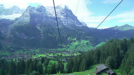 Grindelwald-with-Alps-Mountain-in-Switzerland---view-from-cable-car-moving