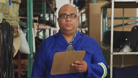 worker writing notes and smiling