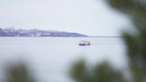 river scene with boat and city skyline