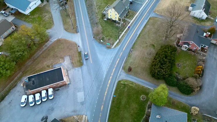 Aerial view of car crossing traffic intersection