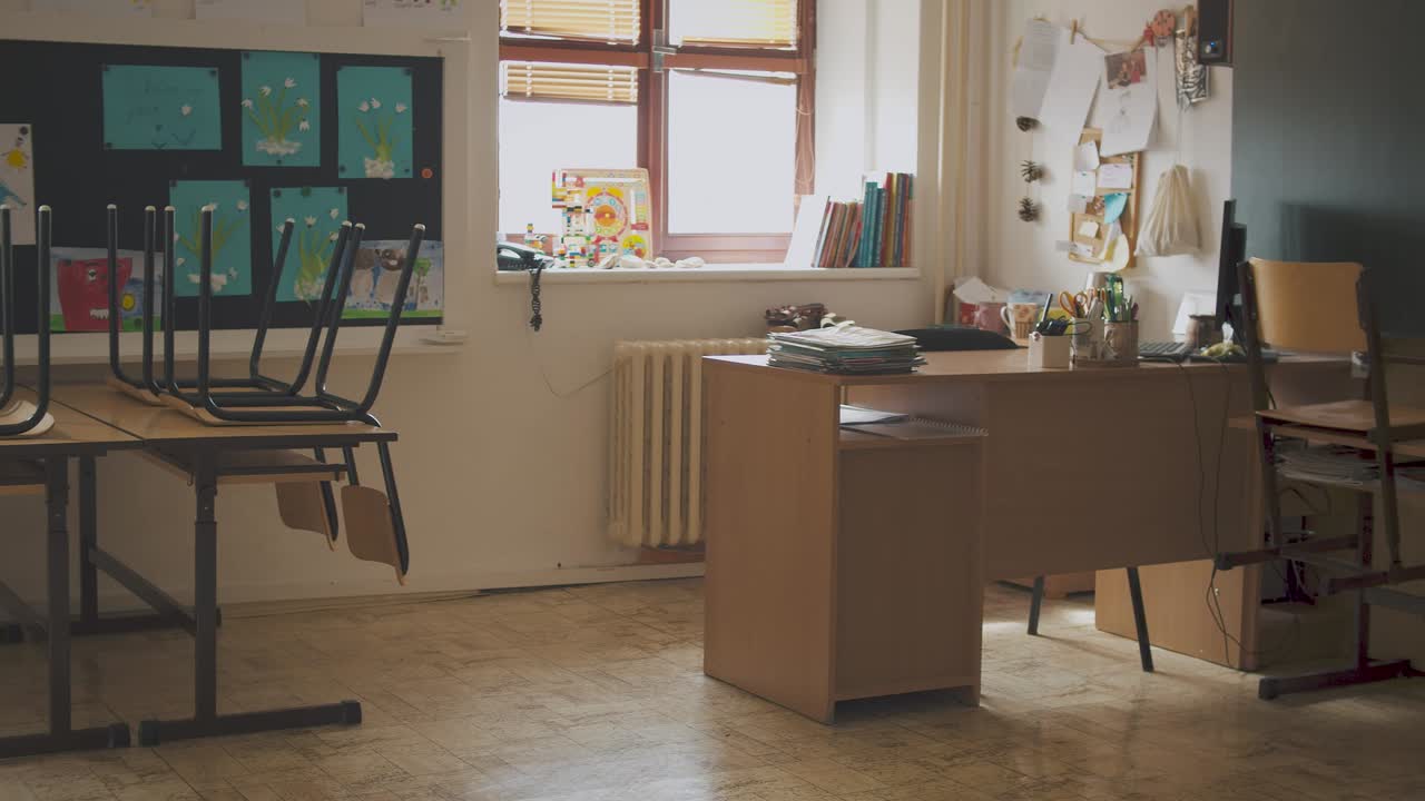 Empty school classroom during a covid pandemic. Camera slow pan across classroom.