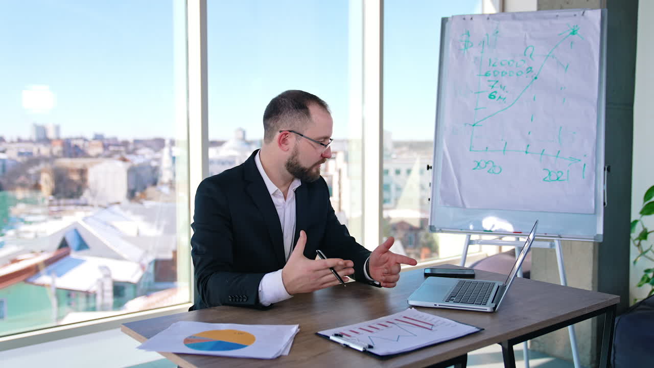 Entrepreneur working in office. Businessman in suit sitting at his workplace. Dispirited office worker throws papers. Business problems.