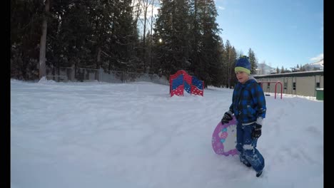 girl playing in the snow during winter 4k