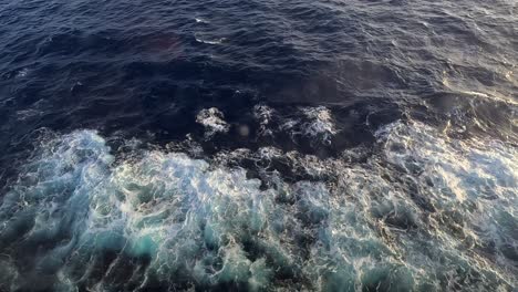 view of the beautiful sunset and ocean waves from the cruise liner window in the mediterranean sea