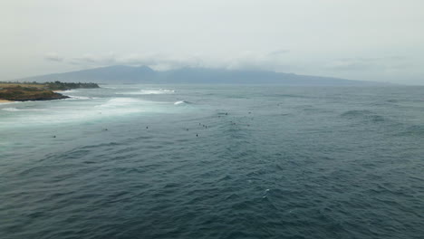 surfers waiting for a tide, people swimming in endless, infinite ocean