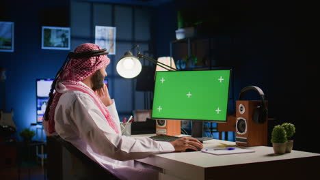 man looking at mockup computer screen