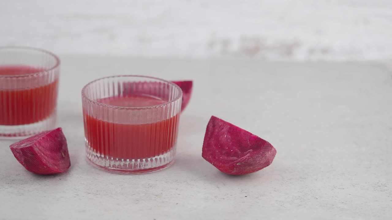 Fresh Beetroot Juice in Glasses with Raw Beetroot Pieces